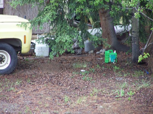 Propane tanks and oil jug.